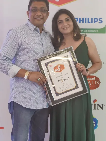 Posing with my husband and my Big F Award. His support has been instrumental in my journey as a home baker, and it was special to share this achievement with him.
