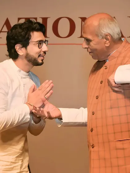 A candid moment of interaction during the National Icon Award ceremony.