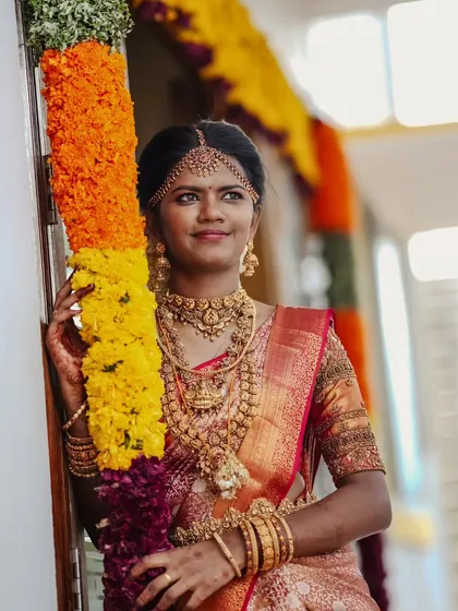 Another angle of Swapna's muhurtham look, highlighting the intricate details of her temple jewelry and the flawless makeup.