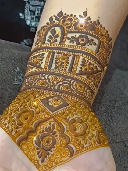 A close-up of the beautiful cuff part of this design. The details are inspired by royal architecture and jewelry.
