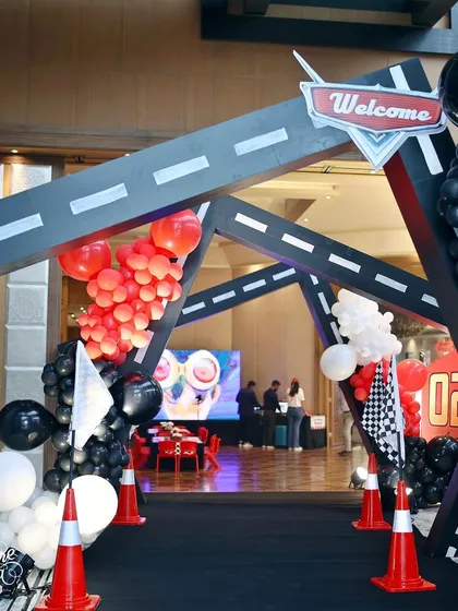 The entrance to the Cars party was a tunnel of roadways, complete with traffic cones and balloon clusters, making guests feel like they were driving right into the event.