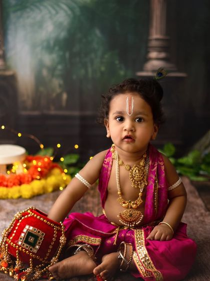A beautiful portrait of a baby boy dressed as Little Krishna for Janmashtami. His innocent gaze and traditional attire are just perfect.