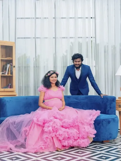 Celebrate your pregnancy with a fun and stylish studio photoshoot. This ruffled pink maternity gown is a client favorite, and I also provide coordinating suits for partners to complete the look for your pregnancy announcement photos.