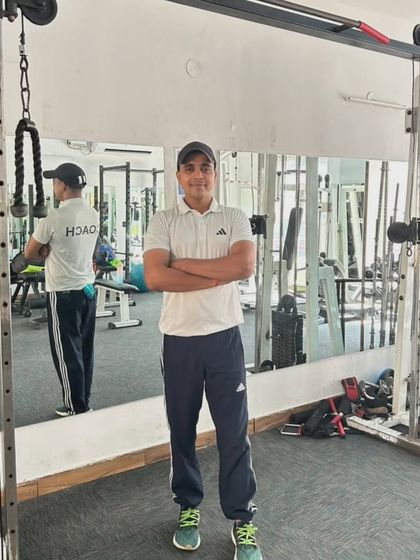At the gym in Noida Sector 99. You can see 'COACH' on my back because that's who I am, dedicated to my students.