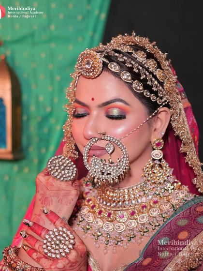 A close-up that highlights the colorful and metallic eyeshadow, a popular choice for Rajasthani brides to match their vibrant attire.