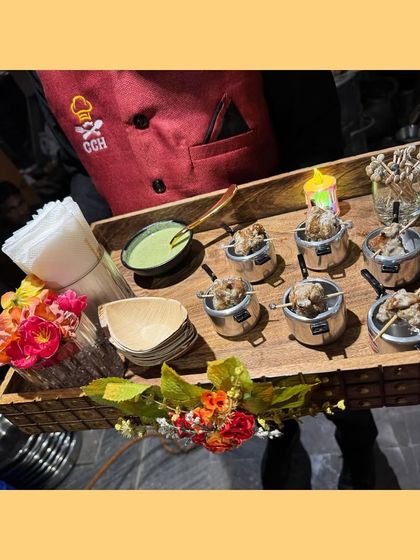 A tray of our famous Chicken Malai Tikka, served in individual mini pots with green chutney. This is melt-in-your-mouth perfection with a touch of tradition.