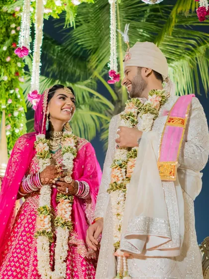 A joyful moment between the bride and groom during their wedding ceremony. Their shared laughter shows the friendship and happiness at the core of their relationship.