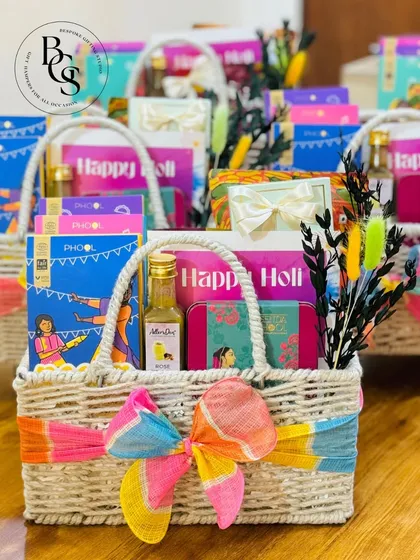 Celebrating the festival of colours with these vibrant Holi gift hampers. The bright, multi-coloured ribbon and assortment of festive items capture the joyful and playful spirit of Holi, making it a perfect gift for the occasion.