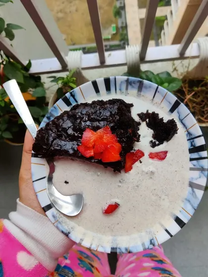 Another angle of my delicious vegan brownie creation. The combination of warm, gooey chocolate brownie and cold, creamy ice cream is a match made in dessert heaven.