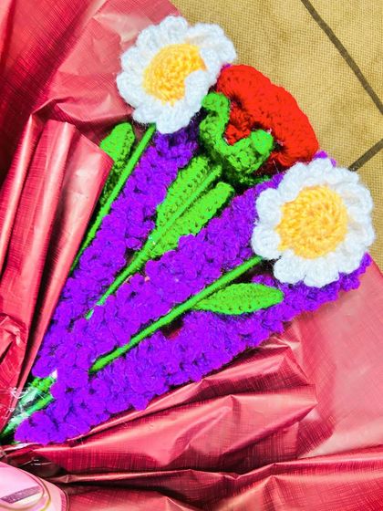 A close-up view of the detailed stitch work on my crochet daisies and lavender stems. I use quality yarn to ensure the colors are bright and the flowers last forever.