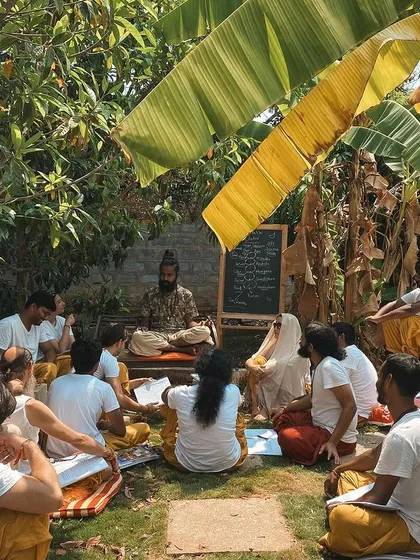 This is a duplicate of image 255, showing a philosophy class held in the shade of the banana trees, a perfect example of our 'back to nature' approach.
