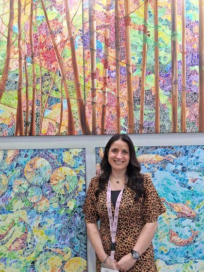 Artist Roudaina with her stunning mosaic artworks at World Art Dubai. Her intricate pieces, which blend color and texture, were a testament to the global talent present at the fair.