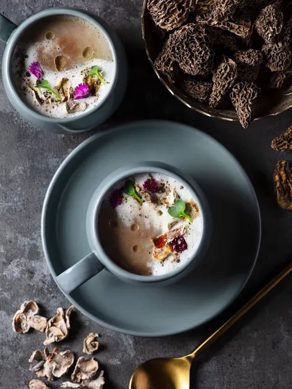 This cozy shot of Morel mushroom soup was perfect for the winter menu at The Khyber Resort. The top-down angle and earthy tones of the mugs and dried mushrooms create a warm and comforting feel.