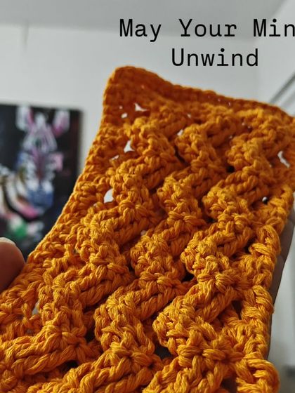A close-up of a beautiful cable stitch pattern in a warm mustard yellow. This is a work in progress for my 'May Your Mind Unwind' series, highlighting crochet as a form of therapy.