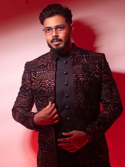 All set to steal the spotlight. A stylish portrait of a groom-to-be, exuding class and confidence in his intricately designed wedding attire.