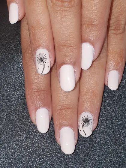 A simple and meaningful design. This client wanted a clean, off-white base with a delicate, hand-painted dandelion on the accent nails.