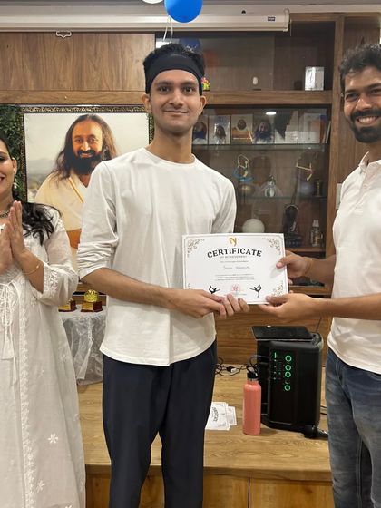 A member of the "Yog Mitra" team receiving his certificate from me. It's a pleasure to honor the efforts of our dedicated students.