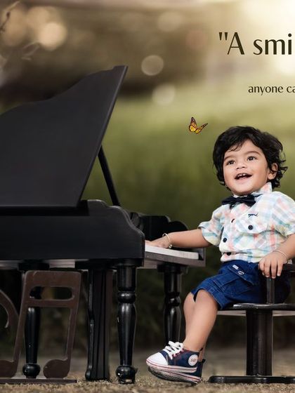 A smile is the best makeup anyone can wear. This boy's infectious grin is the highlight of this outdoor piano-themed portrait.