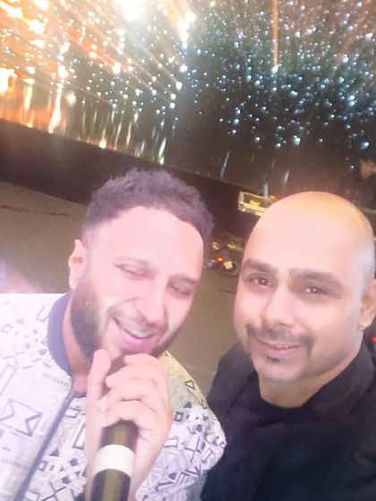 Backstage with Bollywood singer Ash King before our performance at a corporate awards show. We work together to plan a set that blends his live singing with my DJ tracks seamlessly.