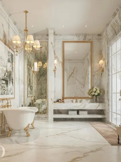 Even the most functional spaces can exude opulence. For this washroom, I selected white marble for its radiant and timeless quality, pairing it with gold fixtures and a classic clawfoot tub to create a bright, open, and serene retreat.