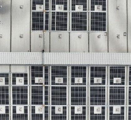 An overhead drone shot of the 640 KWp rooftop solar installation at the Velan Valves facility in Tamil Nadu. This view highlights the efficient use of roof space to maximize clean energy generation.