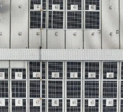 An overhead drone shot of the 640 KWp rooftop solar installation at the Velan Valves facility in Tamil Nadu. This view highlights the efficient use of roof space to maximize clean energy generation.