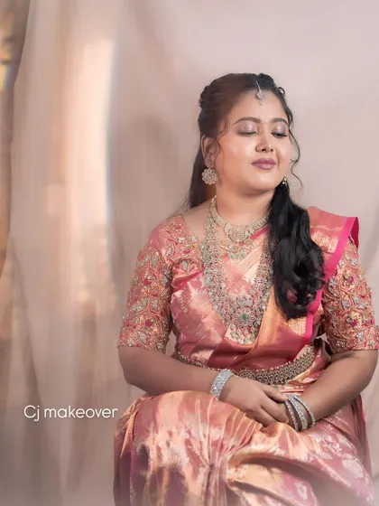 A beautiful portrait of a bride enjoying a quiet moment during her reception. Her makeup is soft and elegant, with a focus on her eyes.