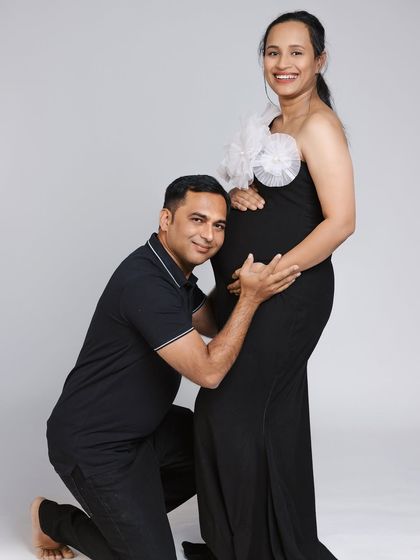 A happy couple's portrait. The Veneccia gown is a versatile choice that can be styled for both classic and modern looks.