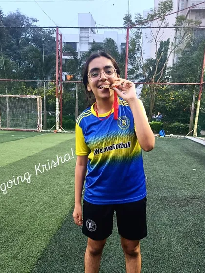 Krisha, a model of consistency and work rate, proudly displays her Player of the Month medal.