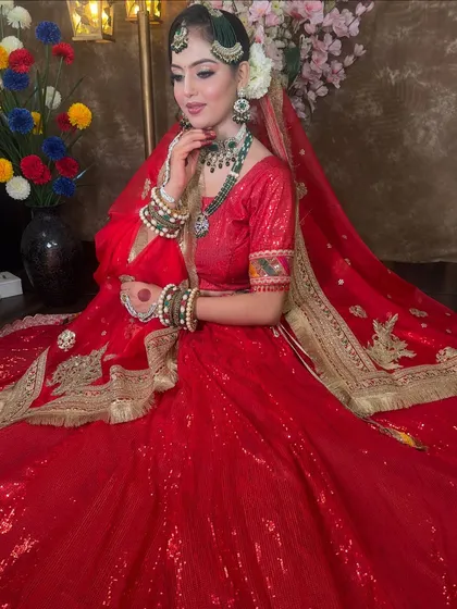 Here is a full view of a sparkling red lehenga, perfect for a bride or for celebrating your first Karwa Chauth. The sequin work is designed to make you shine.