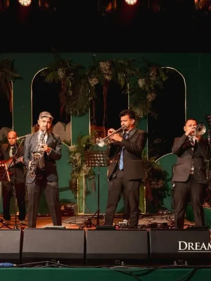 A live jazz band sets a sophisticated mood. Curating the right musical entertainment is crucial for setting the tone of each event, from a relaxed welcome dinner to a high-energy Sangeet.