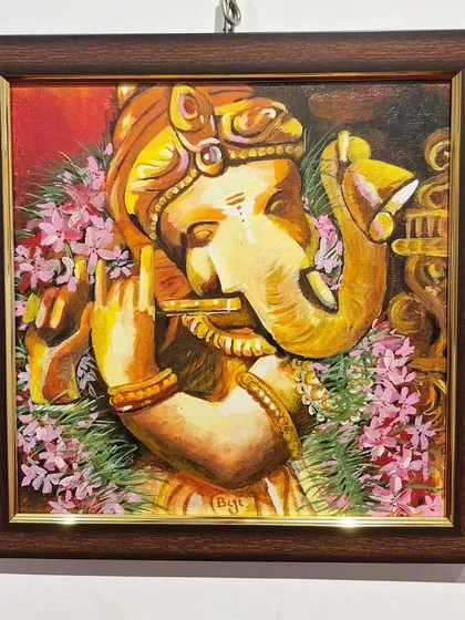 Another view of the 'Murali Ganesha' painting at the exhibition. The warm, golden tones and intricate details are designed to create a feeling of joy and devotion.