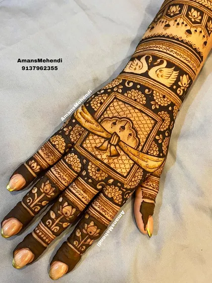 A back-of-hand design featuring a 'gathbandhan' or wedding knot, symbolizing the union of the couple. The design also includes swans and elephants.