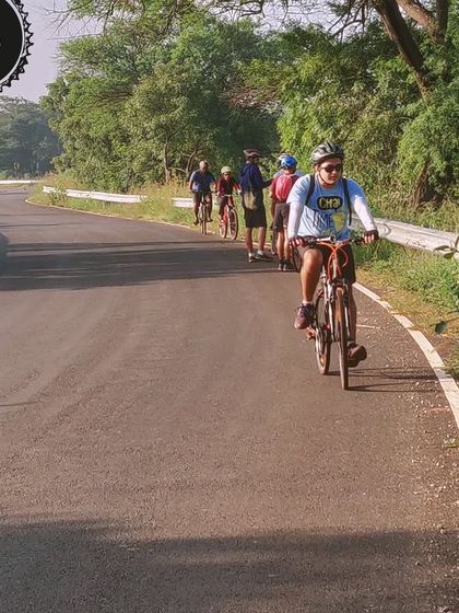 A group enjoys a leisurely ride on a paved road in Hesaraghatta. Our summer series of evening rides are designed to be fun and accessible for everyone.