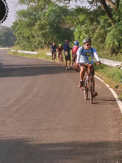 A group enjoys a leisurely ride on a paved road in Hesaraghatta. Our summer series of evening rides are designed to be fun and accessible for everyone.