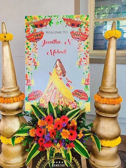A welcome sign for a Mehendi ceremony. The bright and colorful design matches the festive theme of the event.