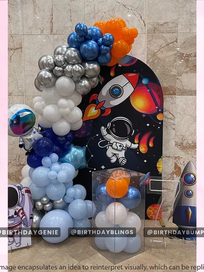 A more graphic and bold space theme, with a dark galaxy backdrop and vibrant planets. The balloon garland is designed to look like rocket exhaust.