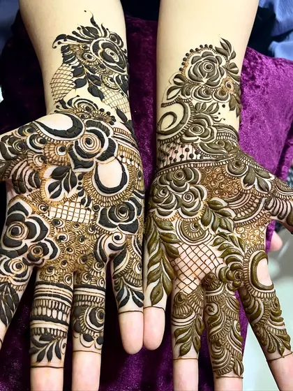 This design shows two different floral styles on each hand, one with negative space and one with shading, demonstrating versatility.