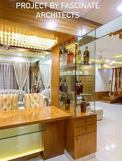 This duplex in Vashi features a custom-designed bar area with under-lit glass shelves and a stunning crystal chandelier. It's a perfect example of how we create dedicated spaces for entertainment and luxury living.