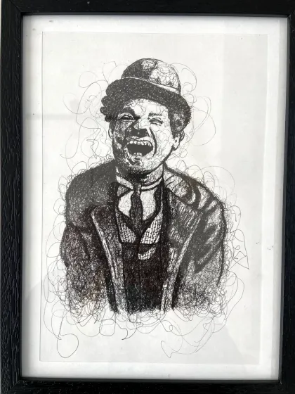 A creative scribble sketch of Charlie Chaplin. This artwork, made by a student, demonstrates a unique and expressive approach to drawing.