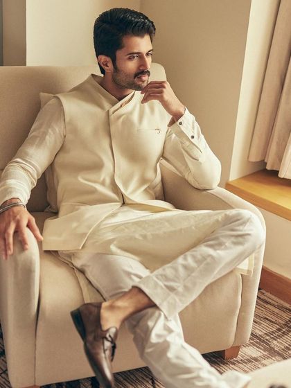 For another 'Kushi' promotion, I chose this elegant all-ivory look for Vijay Deverakonda. The asymmetrical waistcoat adds a modern twist to the classic kurta set.