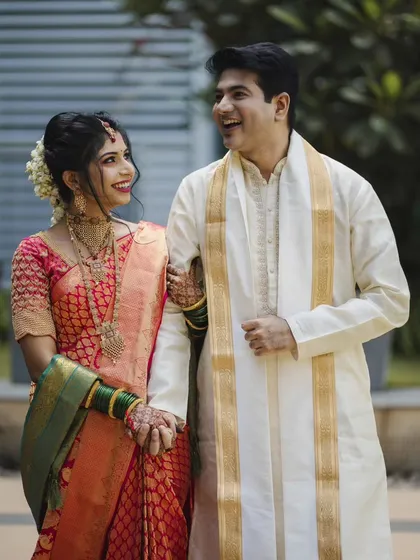 Laughter and love captured in a single frame. Roshan and Meenakshi share a happy moment during their wedding day portraits. We aim to make couples feel comfortable, so their genuine personalities shine through.