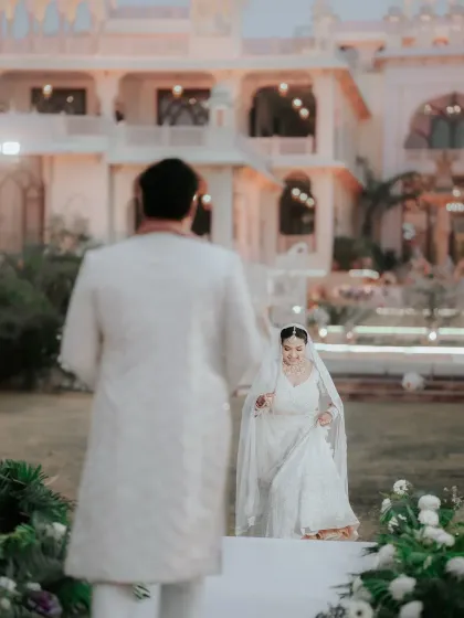 The bride's joyful walk towards her forever. We capture the anticipation and excitement in the moments leading up to the main ceremony, as Ria approaches Rahul.