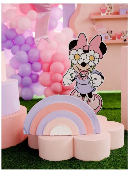 Another view of the groovy Minnie Mouse prop and pastel rainbow, perfect for a fun and stylish birthday party.