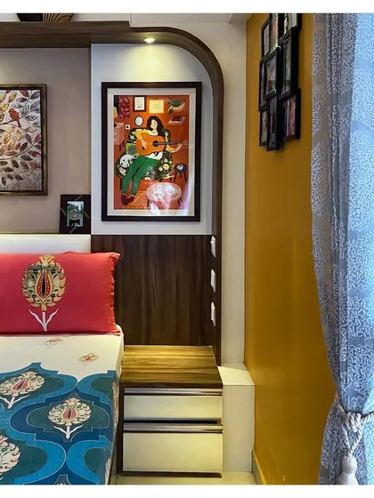 This detail shot highlights the combination of textures and colors, from the client's vibrant art and textiles to the warm wood and neutral wall colors we selected.