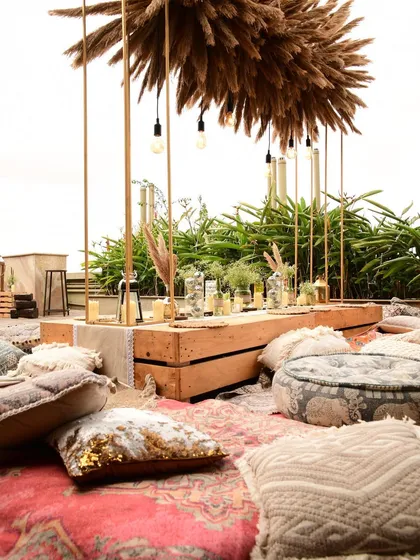 The mix of different rugs and cushions in various textures and patterns is key to achieving that effortlessly layered and comfortable boho look.