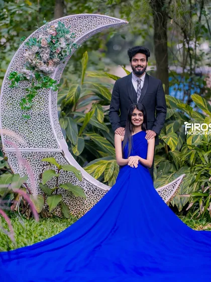 A romantic portrait with a crescent moon prop set amidst the lush greenery of our garden.