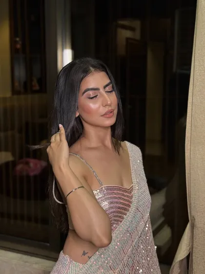 My 'desi girl' Twinkle, looking stunning in a sequin saree. The makeup was kept soft and glowy to let the outfit shine, with a focus on luminous skin and a simple nude lip.