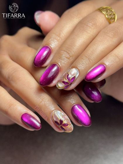 Another angle of the purple cat-eye and floral set, showing how the light catches the metallic and iridescent elements.