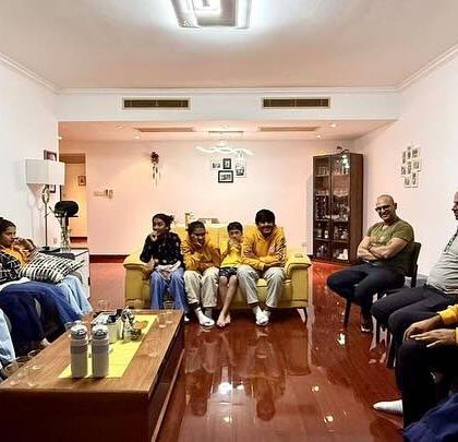 A moment of relaxation and conversation. Our players and coaches enjoying a quiet evening with our hosts in Shanghai.